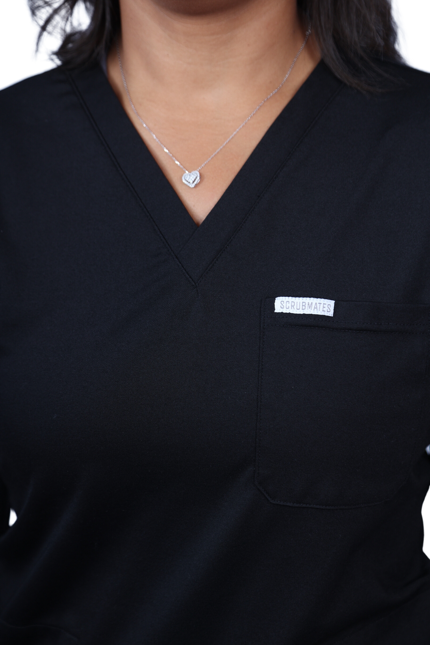 medical work uniform Scrubmates modern fit jogger black scrub pants for women made to pair perfectly with our modern fit jogger pants. Our exclusive design is on trend, professional and stylish. Made from a superior quality nylon/rayon/spandex fabric mix, this set offers unparalleled all-day comfort. Our luxe fabric blend offers the ultimate amount of stretch, and is designed to be flattering at every angle innovative design offers a chest pocket and 2 kangaroo pockets best scrub set for women figs scrubs